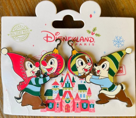 Chip and Dale looking at reflections in baubles