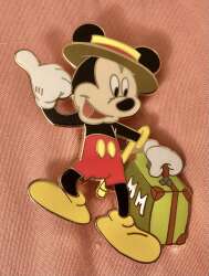 Mickey Hitch hiking with green suit case