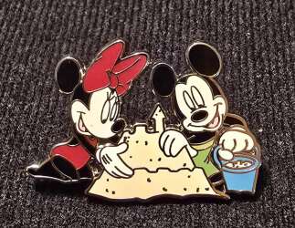 Minnie & Mickey building a sand castle