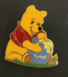 Pooh sitting with honey (hunny) pot