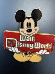 Mickey Mouse holding Walt Disney World sign