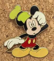 Mickey Mouse wearing a Goofy hat confused