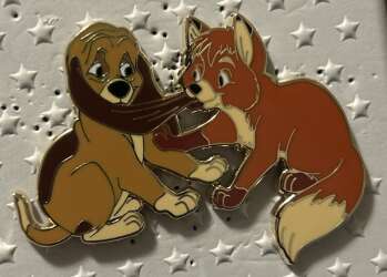 Tod Tugging Copper’s Ear