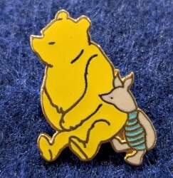 Pooh and Piglet sitting together
