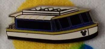 White with yellow and blue trim boat
