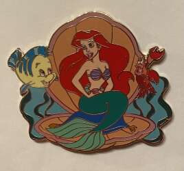 Ariel in peach shell with Sebastian and flounder